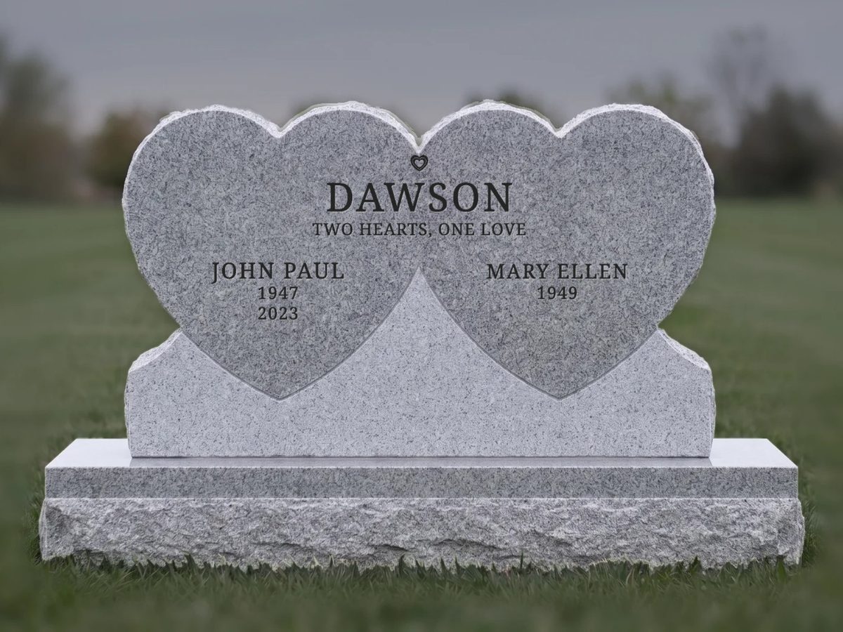 Double heart headstone designed for a couple, one heart each, the Dawson family name across both