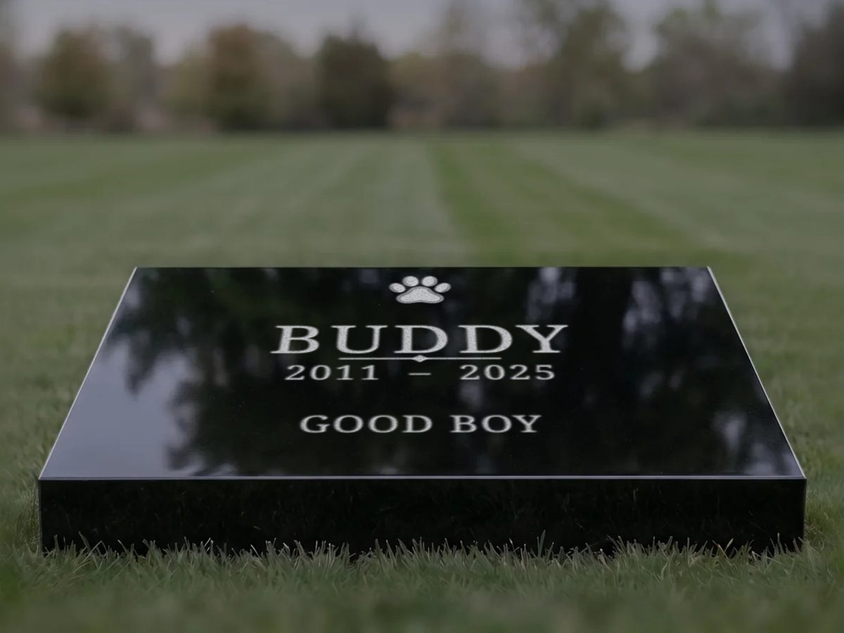 Black granite pet headstone designed for a dog named Buddy, with a paw print and the words Good boy