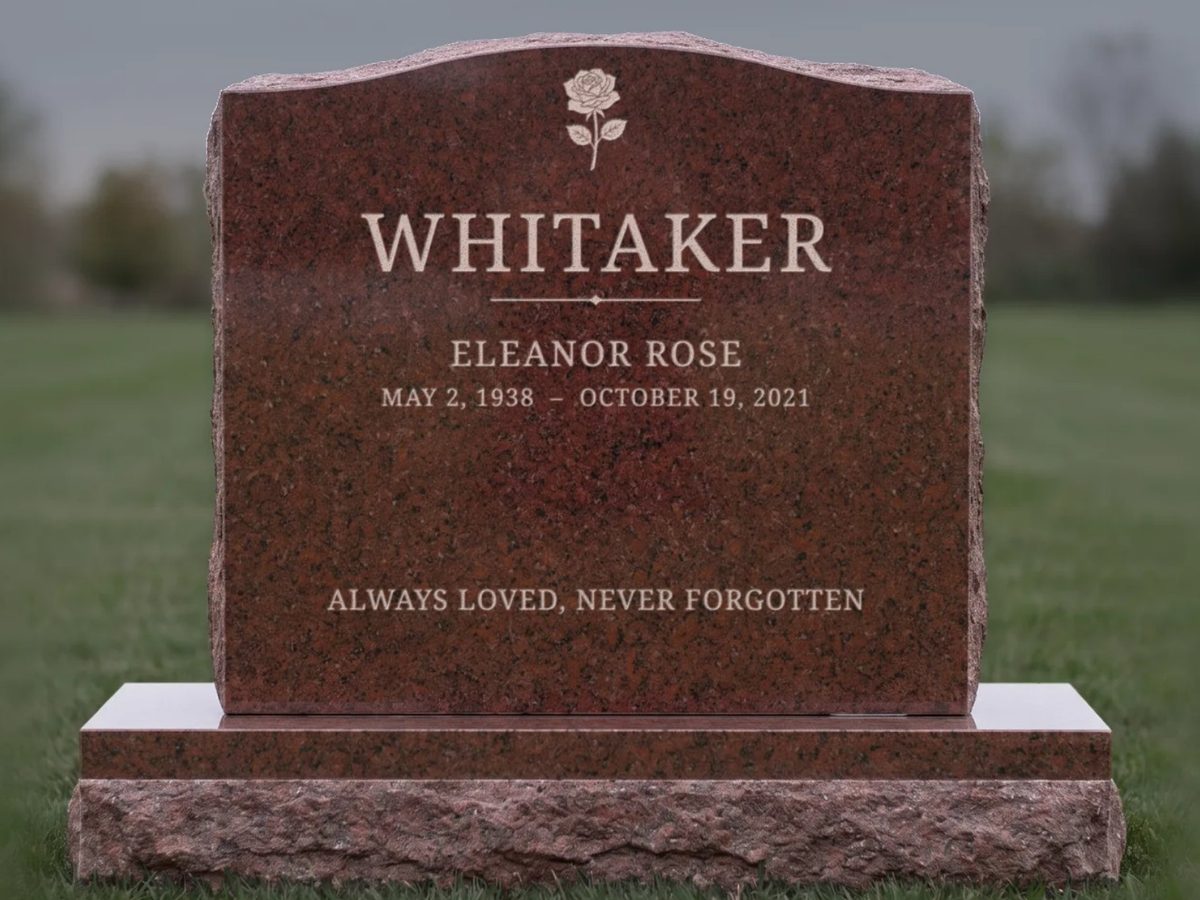 Red granite serpentine headstone design with pale letters: Whitaker, Eleanor Rose, and a rose